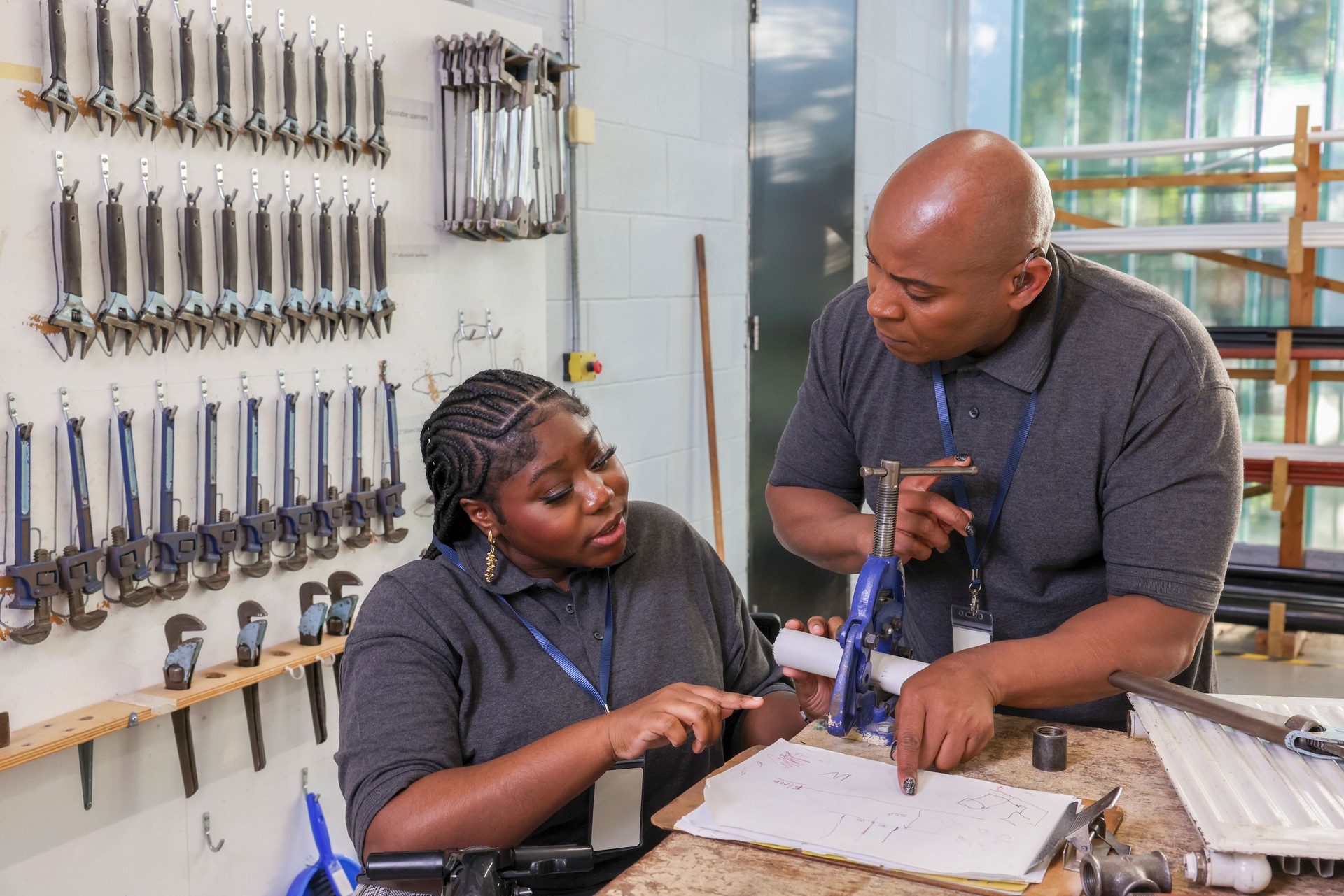 Disabled man and woman working in workshop